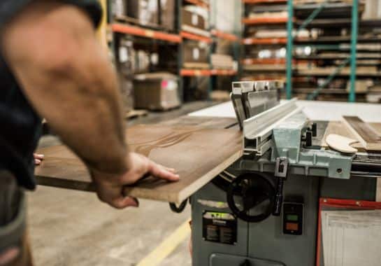 Kpi Concepts Employee Cutting Wood Components For Commercial Manufacturing