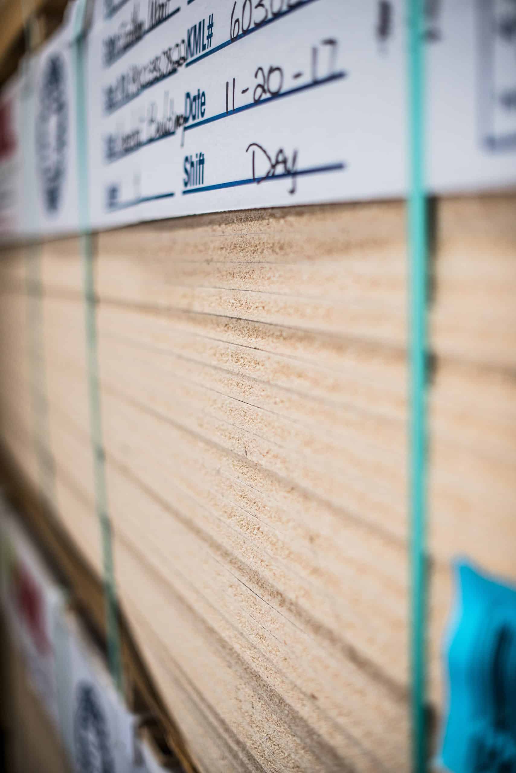 Close-Up Of Stacked Wood-Based Sheet Material In The Kpi Concepts Shop.